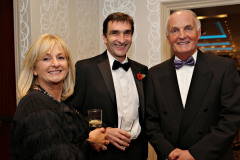 Patricia and Auctioneer Philip Tweedie with Wavell Moore of the Zomba Action Project at the Annual President's Dinner held in the Lodge Hotel.     26 Causeway