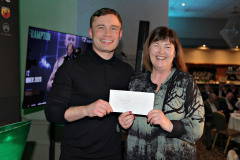 Pauline Scullin receiving her prize draw from special guest boxer Carl Frampton MBE at the President\'s Annual Dinner held at the Royal Court.       66 Presidents Dinner Formal
