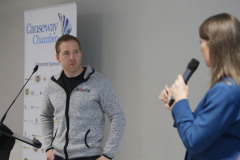 Dr Jonny Bloomfield Health and Performance Coach taking questions from host Sarah Travers at the Causeway Chamber of Commerce's  conference on Skills, Scaling and Social Values held at the Marine Hotel In Ballycastle.